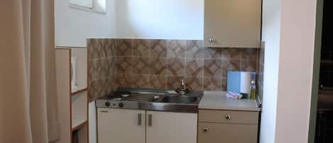 Fridge, coffee/tea maker, electric kettle, toaster