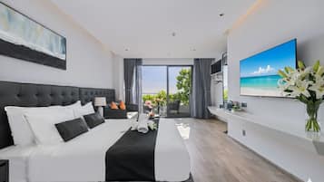 Suite, balkon, pemandangan samudra | Seprai premium, busa memori, minibar, dan brankas
