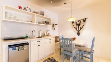 Fridge, microwave, stovetop, coffee/tea maker