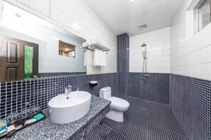 A bathroom with a white sink, toilet, and shower. - Lufeng Jiali Express Hotel (Lufeng)