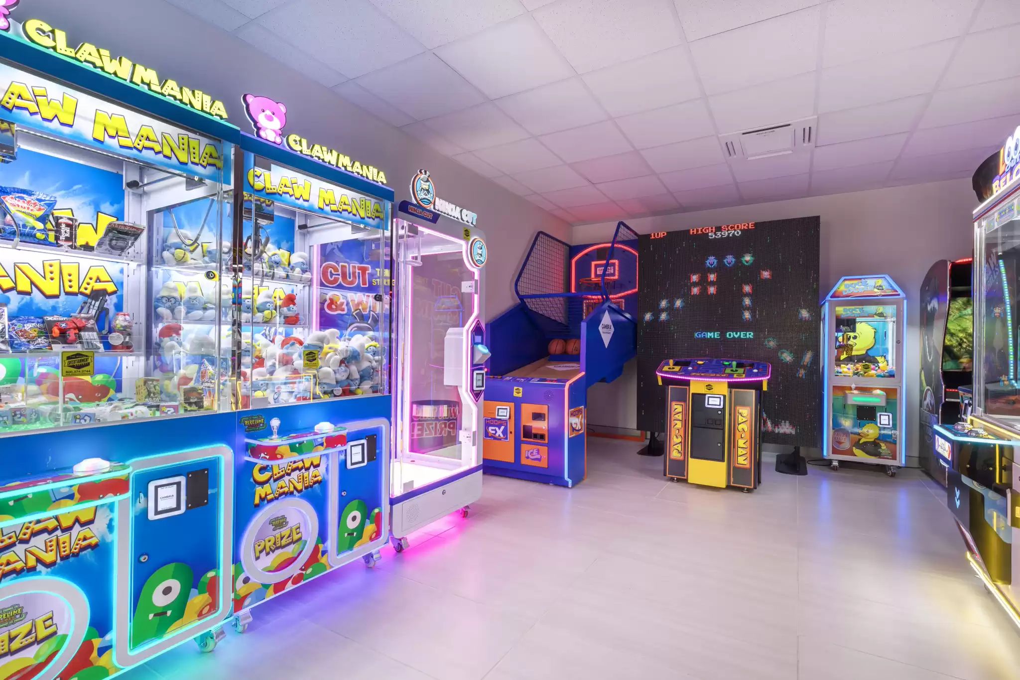 A claw machine arcade with various games and prizes.