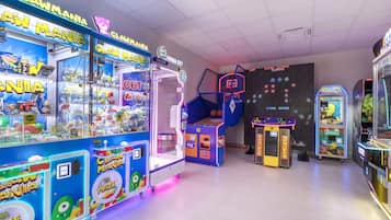 A claw machine arcade with various games and prizes.