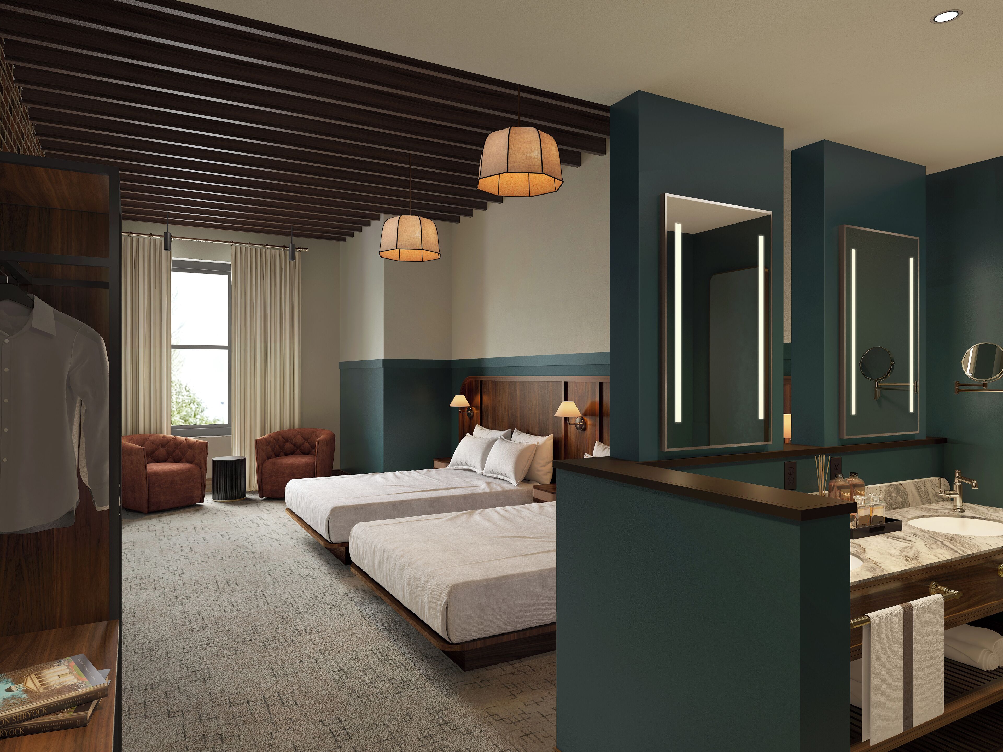 A hotel room with two beds, a sitting area, a large mirror, and a bathroom with a marble countertop.