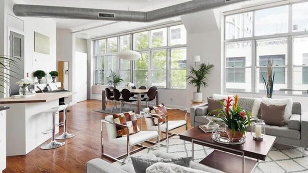 A spacious living area with a kitchen, dining table, and seating arrangements. - Kosher House (Brooklyn)
