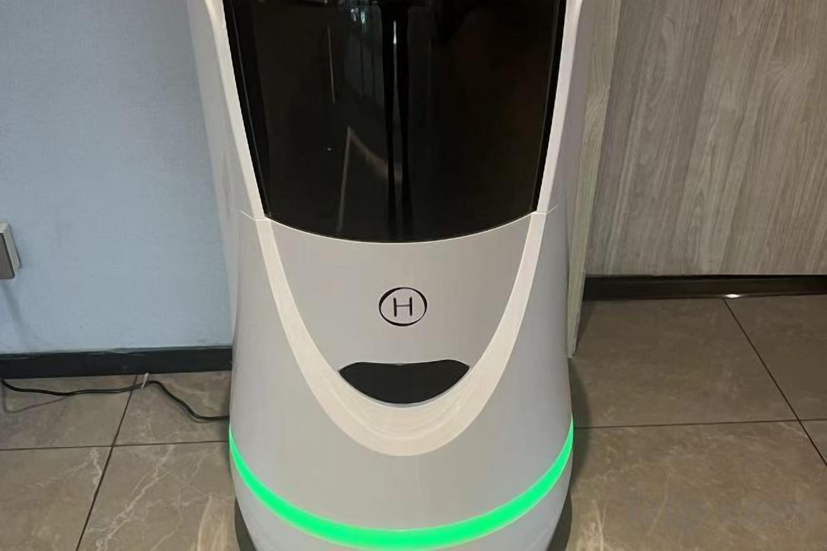A modern, compact, and sleekly designed electric vehicle with a prominent logo on the front.