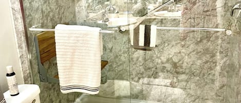 Shower, hair dryer, towels, toilet paper