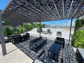 A rooftop terrace with outdoor seating, a pergola, and a city view. - Caballito Retreat Pool and Balcony for up to 4 People (Buenos Aires)