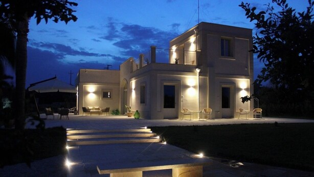 A modern two-story house with a covered outdoor seating area and a staircase leading to the entrance. - "Tenuta Lu Beddhru" Oasis of peace in Salento a stone's throw from the sea  (Carpignano Salentino)