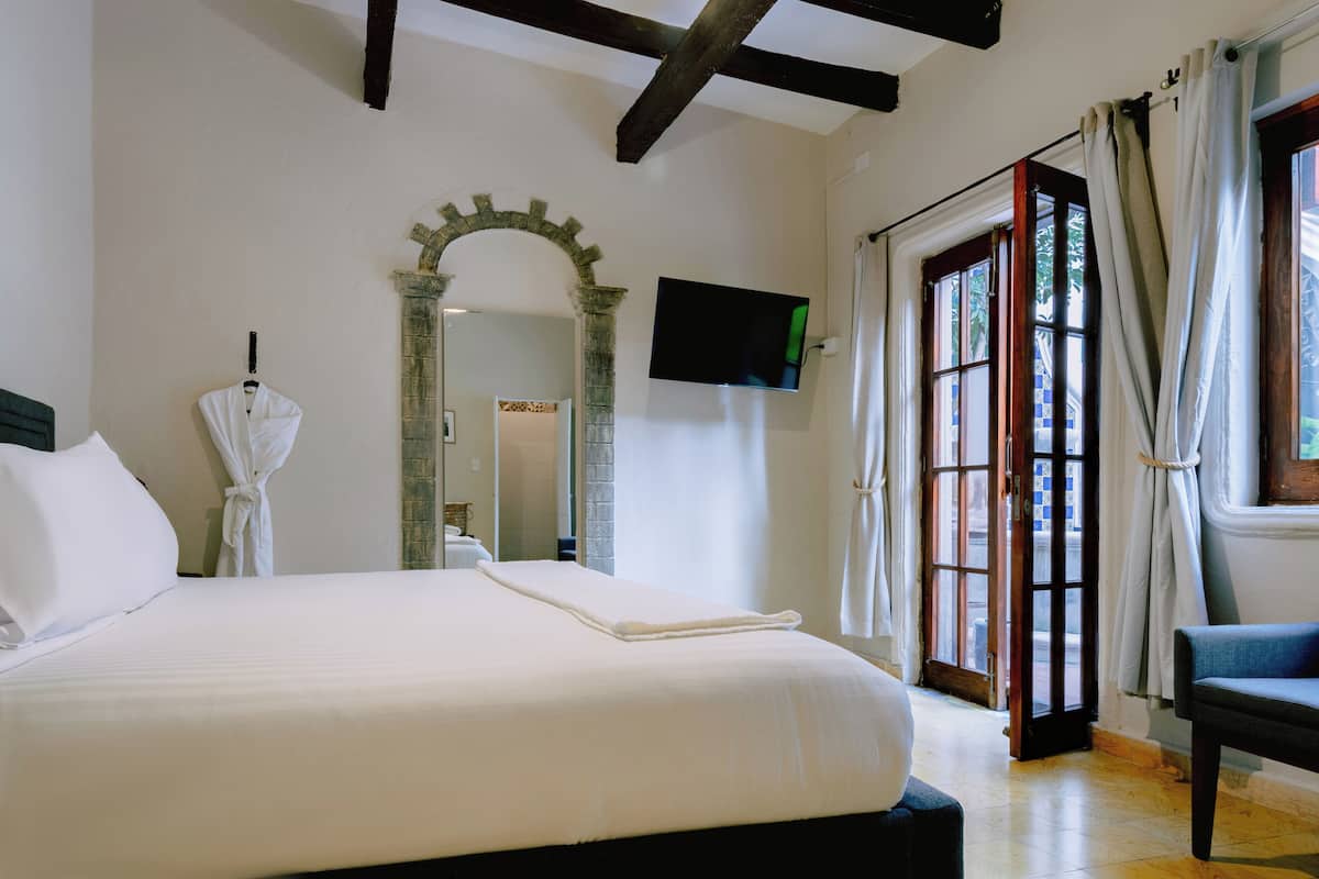 Deluxe Room, 1 King Bed | 1 bedroom, in-room safe, iron/ironing board, free WiFi