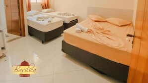 A hotel room with two beds, a ceiling fan, and a window with curtains. - Basilica Palace Hotel (Aparecida)