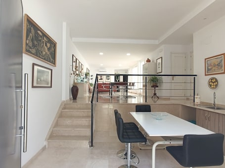 Superior Apartment, Courtyard View | Private kitchen | Mini-fridge, microwave, stovetop, cookware/dishes/utensils