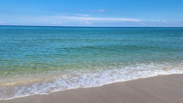 On the beach, sun loungers, beach towels