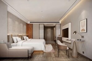 A modern hotel room with a large bed, a sofa, a desk, and a mirror. - Xiangtan Jinguiyuan Hotel (Government City Wanda Plaza) (Xiangtan)
