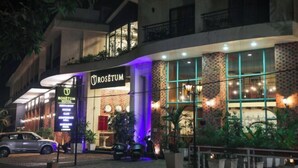 A hotel with a modern facade, including a prominent sign for Rosetum Hotel. - Rosetum Anjuna Goa (Anjuna)
