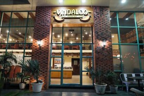 A storefront with a sign reading 'VANDALOO' and a brick facade. - Rosetum Anjuna Goa (Anjuna)