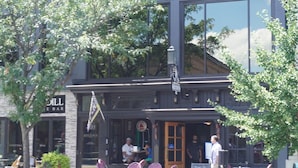 A building with a sign reading "The Benjamin Hotel." - The Benjamin Hotel (Watkins Glen)