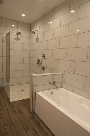 Separate bathtub and shower, hair dryer, towels, soap