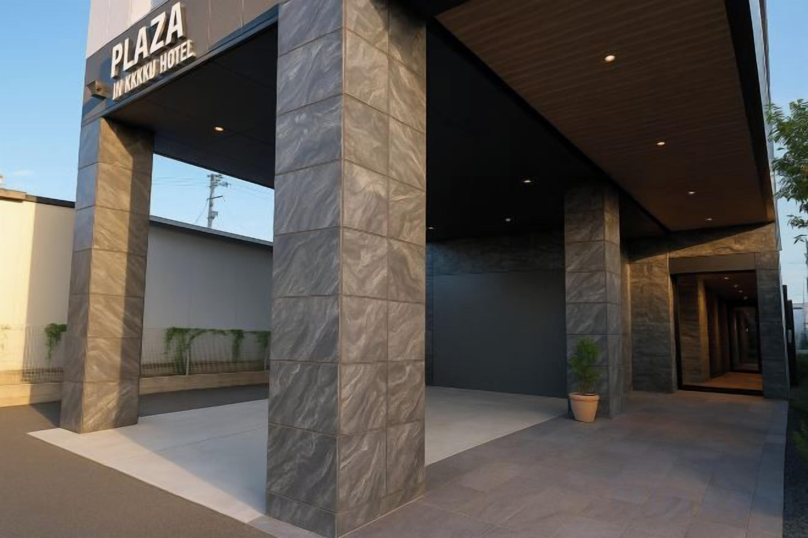 A modern building entrance with a sign for 'PLAZA IN KARKH HOTEL.'