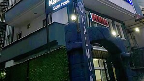 A multi-story building with the sign "Kalmuk Suite Hotel" indicating it is a hotel. - Kalmuk Suite Hotel (Trabzon)