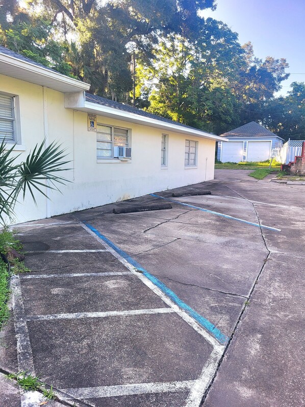A parking lot with a building in the background. - Charming 1925 House in the Heart of DeLand. (DeLand)