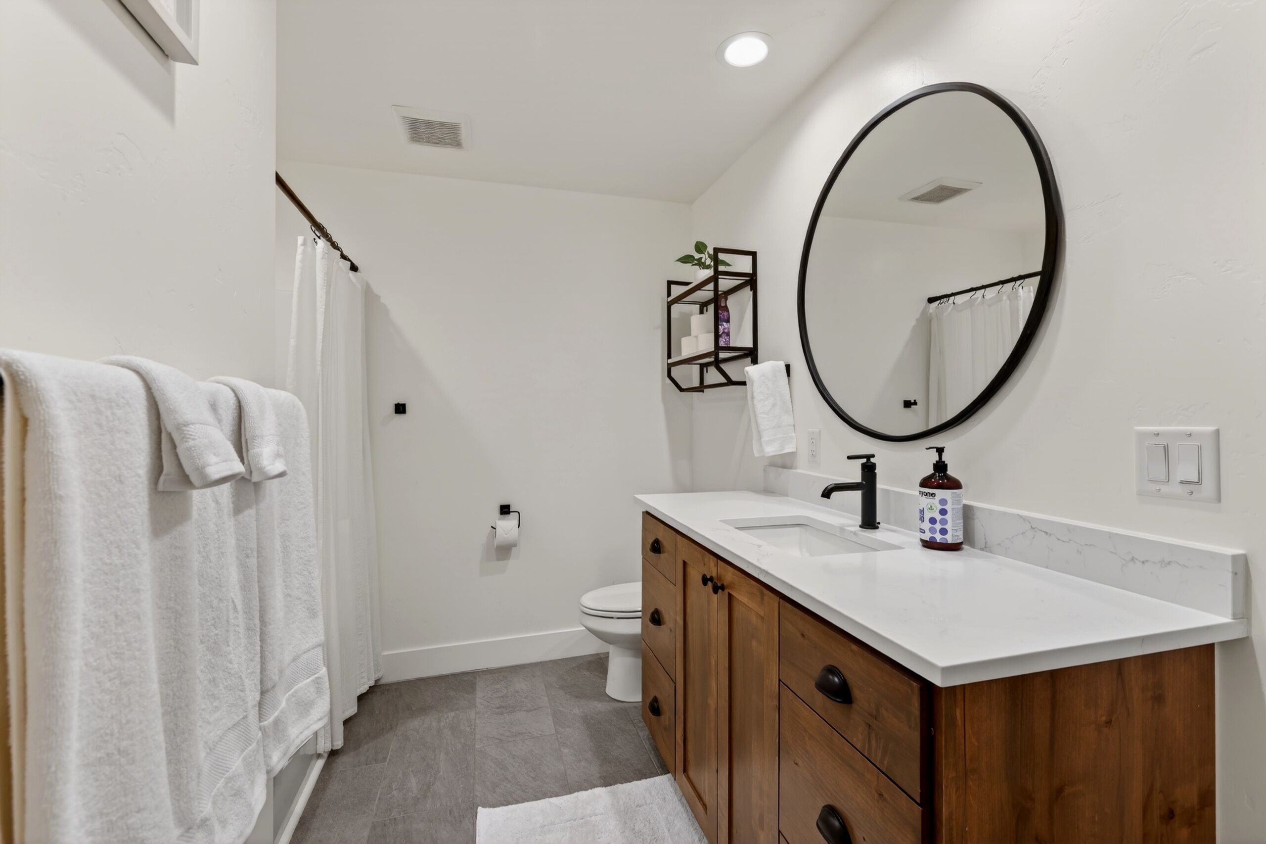 Downstairs bathroom with shower/tub and large vanity sink