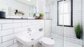 Shower, hair dryer, towels, soap