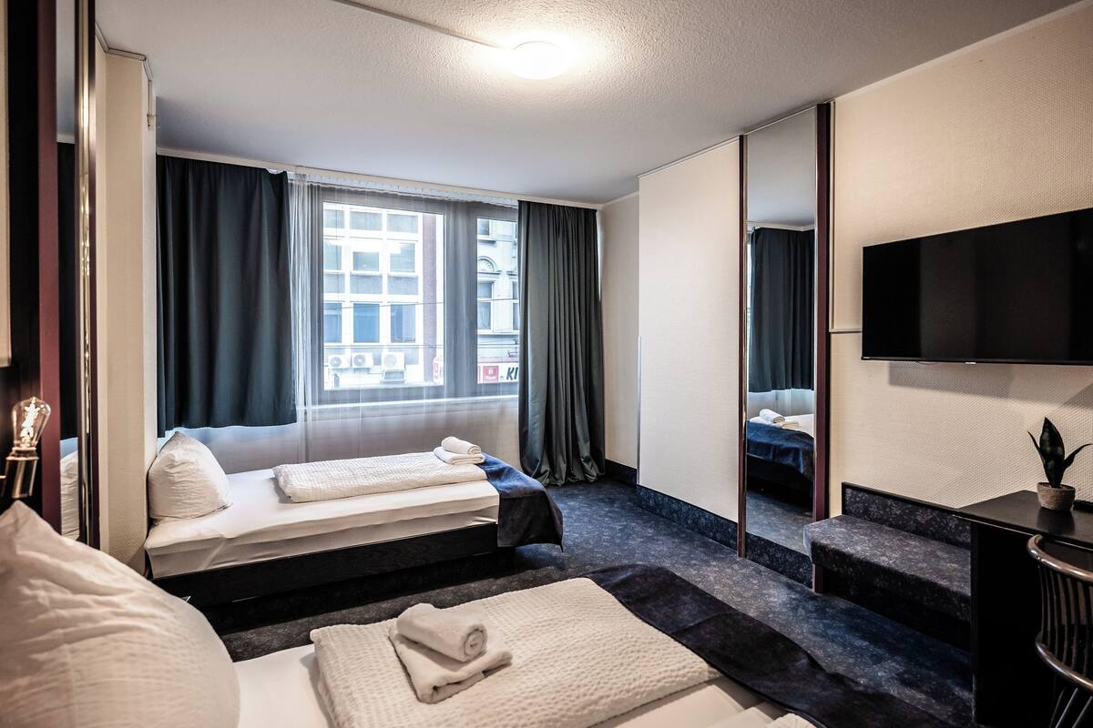 Habitación triple estándar | Escritorio, espacio para trabajar con laptop y wifi gratis 