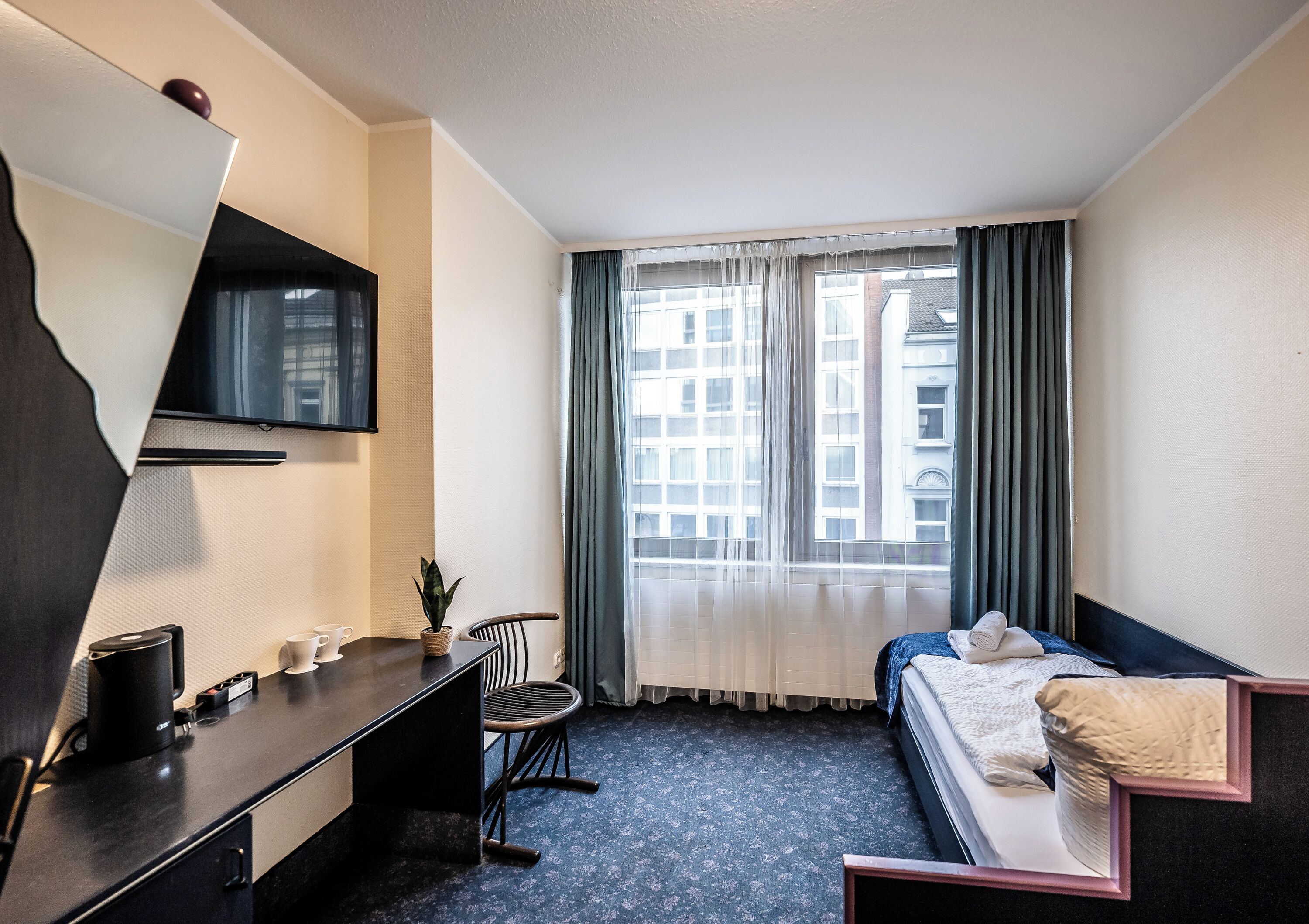 Desk, laptop workspace, free WiFi, bed sheets