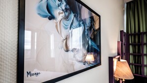 A framed abstract painting titled 'Mirage' on a wall. - Hotel Mirage Düsseldorf-Neuss (Neuss)