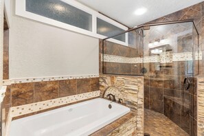 Shower, jetted tub, towels