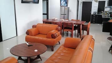 Executive Apartment | Living area | 55-inch Smart TV with digital channels