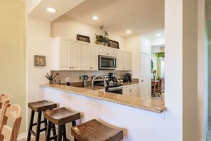 Fridge, microwave, oven, stovetop - Stunning 3BR Naples Condo with Tropical Views (Naples)