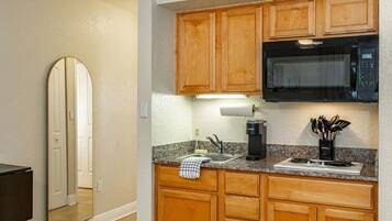 Fridge, microwave, stovetop, coffee/tea maker