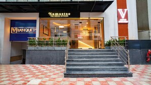A hotel entrance with a sign for 'Namaste The Indian Kitchen' and 'State Hotels'. - Stae Hotels (Hyderabad)