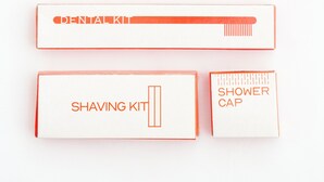 A set of toiletry items including a comb, shaving kit, and shower cap. - Stae Hotels (Hyderabad)