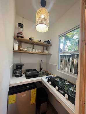 Fridge, coffee/tea maker, cookware/dishes/utensils