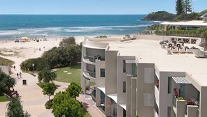A beachfront hotel with a pool area, a beach, and ocean views. - Slice Of Paradise - Direct Resort & Beach Access Apart - 3 Bed - Ocean Views (Cabarita Beach)