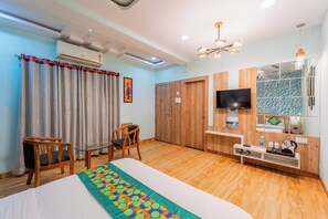 Deluxe Room | 1 bedroom, desk, blackout curtains, iron/ironing board