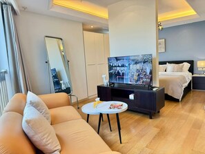 Studiosvit Comfort - 1 sovrum - pentry - utsikt mot staden (1217) | Vardagsrum | 60-centimeters tv med kabelkanaler