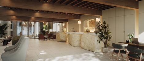 A spacious lobby with a high ceiling, wooden beams, and a seating area with sofas and chairs.