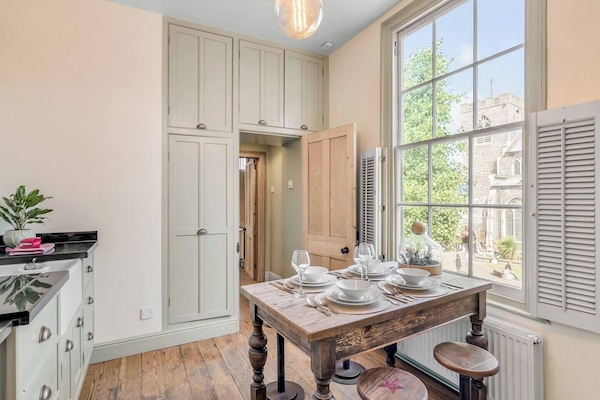 The property includes a dining table with seating for four, providing a perfect space for meals and gatherings.