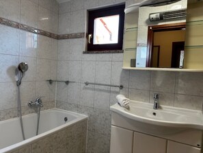 Shower, hair dryer, towels