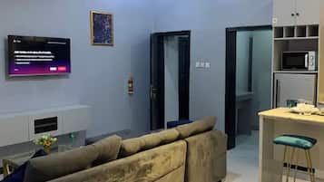 Deluxe Studio, Kitchen | Ruang tamu | TV skrin rata
