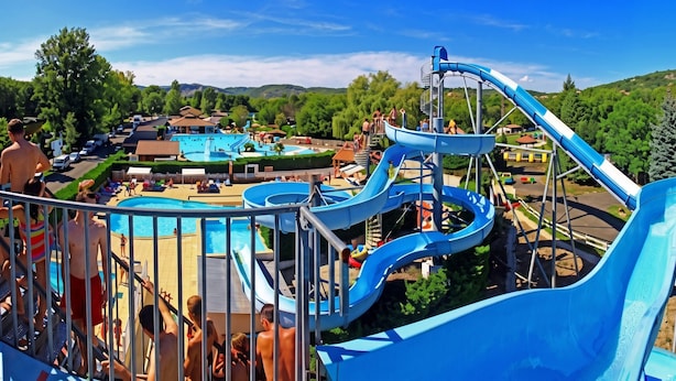 A water park with multiple slides and a swimming pool. - Exclusive Secluded Villa: Truffle Oak Forest, Private Pool & Panoramic Lake View (Lissac sur Couze)