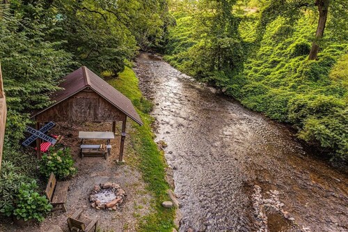 Experience tranquility at Alarka Creek Oasis with a serene creekside view.