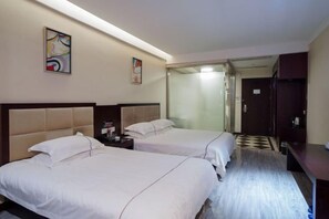 A hotel room with two beds, a desk, and a wardrobe. - Borui Business Hotel (Tongxiang)