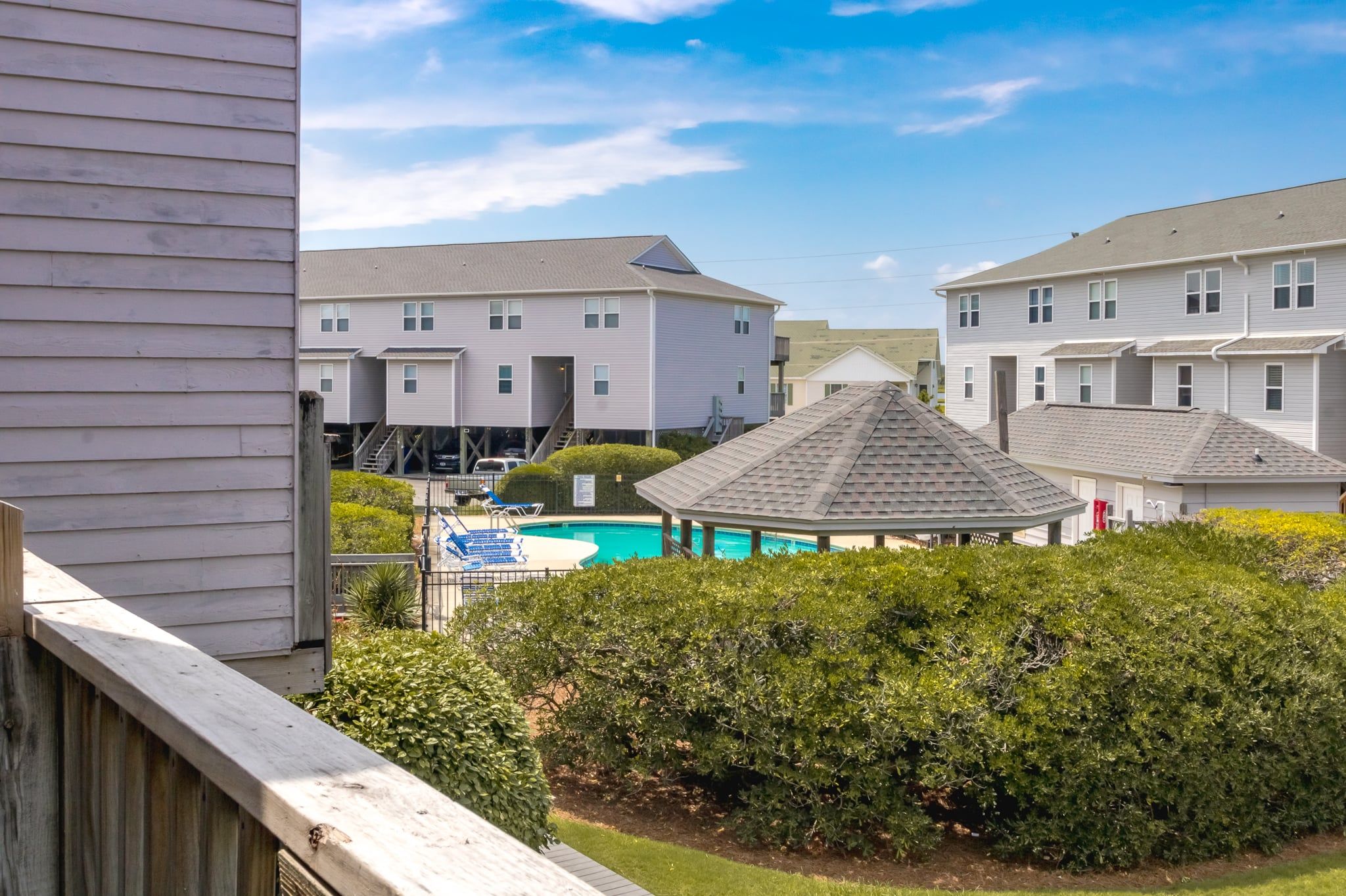 A residential area with a swimming pool and a gazebo.