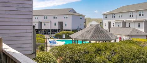 A residential area with a swimming pool and a gazebo.