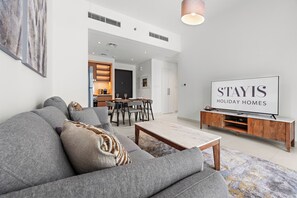 Deluxe Apartment, Balcony | Living area - Stayis-Luxurious 1 Br Burj khalifa view (Dubai)