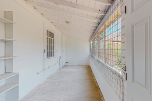 Corridors lead to a serene view of lush greenery.
